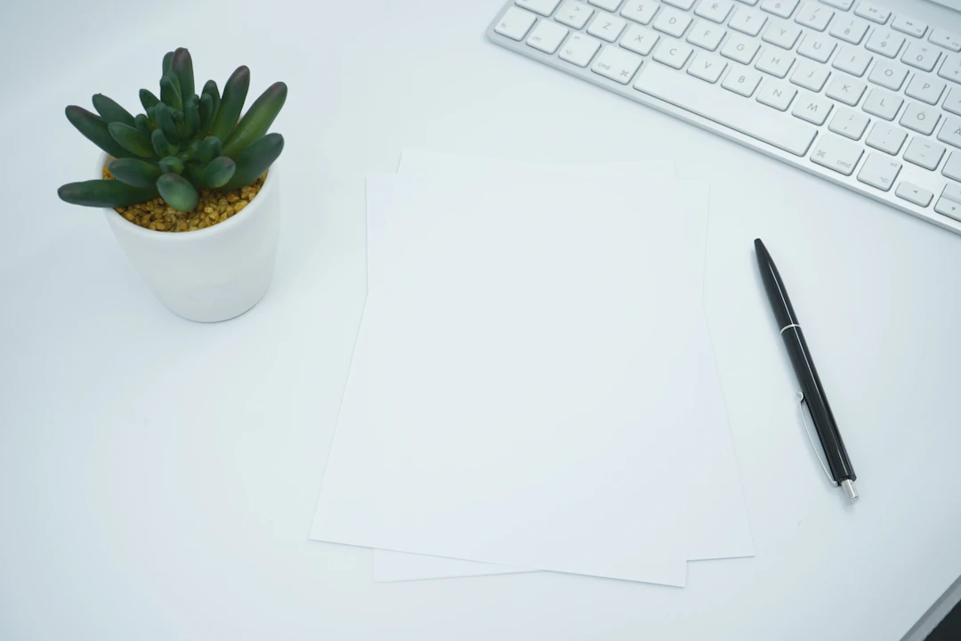 Documents and pen arranged on an office desk