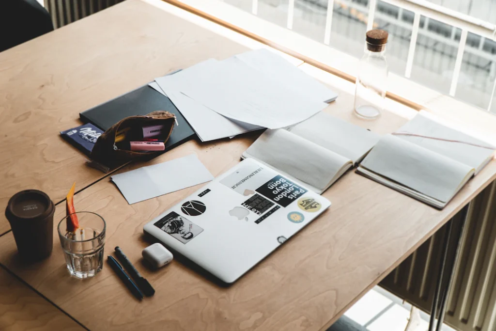 Laptop and paperwork on a desk