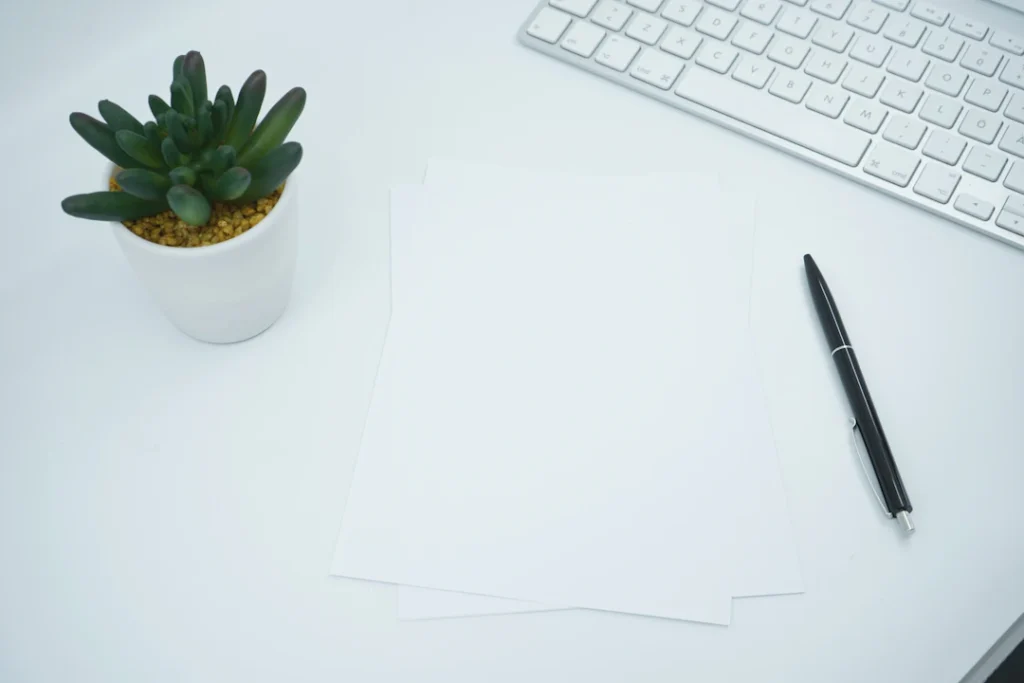 Paperwork and pen on an office desk